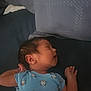 Luke is registered to the contest to win money with this photo: newborn, baby, sleeping, blue_onesie, monkey_pattern, infant, peaceful, resting, pillow, bed, child, person, portrait, cute, small, skin, hair, hand, face, indoors