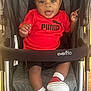 Omri joined the competition — help win amazing prizes! baby, child, stroller, red_shirt, puma_logo, red_sneakers, smiling, happy, infant, footwear, sitting, indoor, baby_clothing, person, cute, baby_toys, evenflo, feet, candid, portrait