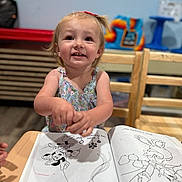 Gracelynn joined the competition — help win amazing prizes! art, cartoon, chair, child, clothing, coloring_book, cute, drawing, education, hair, happy, indoor, person, playful, pony_tail, preschool, smiling, table, toddler, wooden_chair