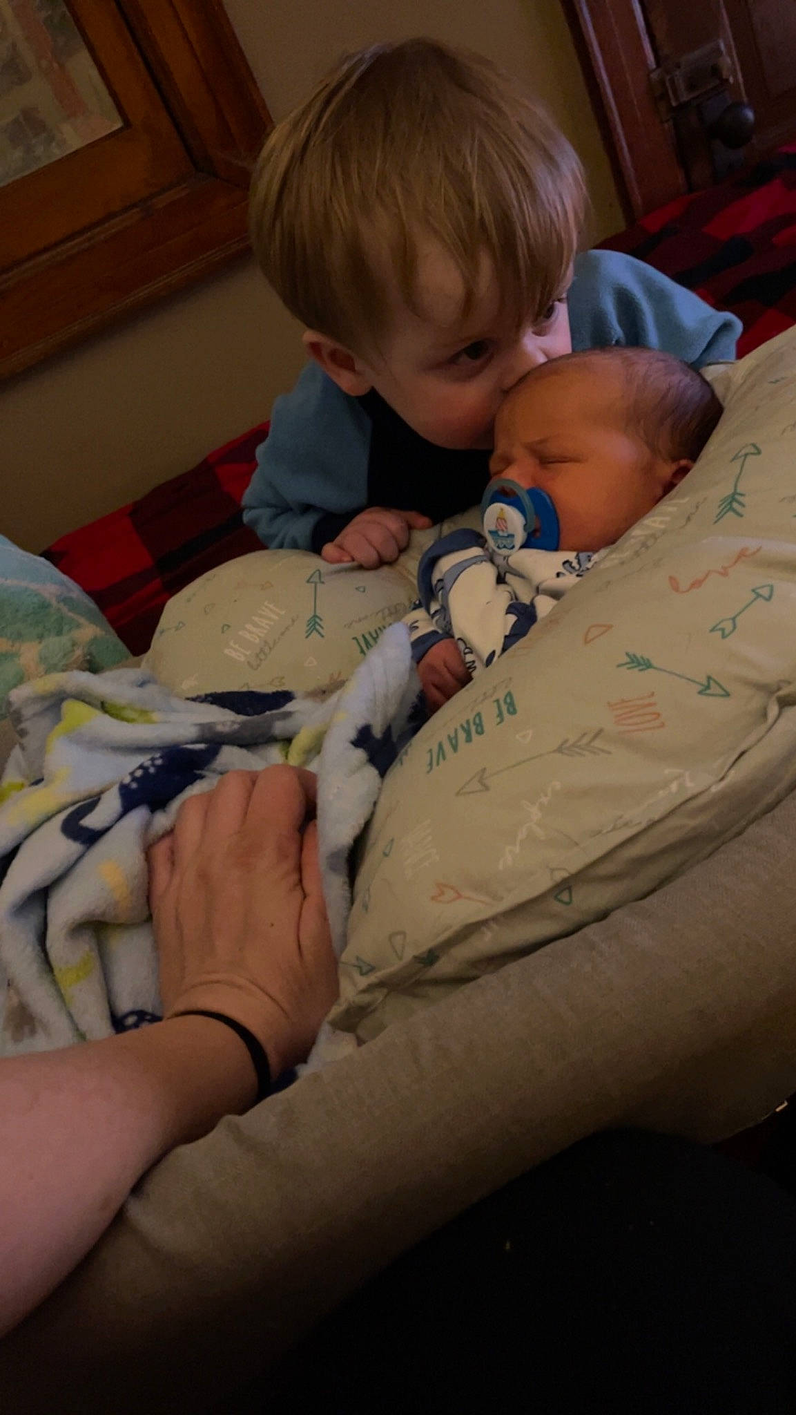 Ryder is registered to the contest to win money with this photo: abdomen, arm, baby, bedding, bedtime, cheek, child, comfort, elbow, finger, head, human_leg, lap, linens, mouth, person, sitting, skin, textile, toddler