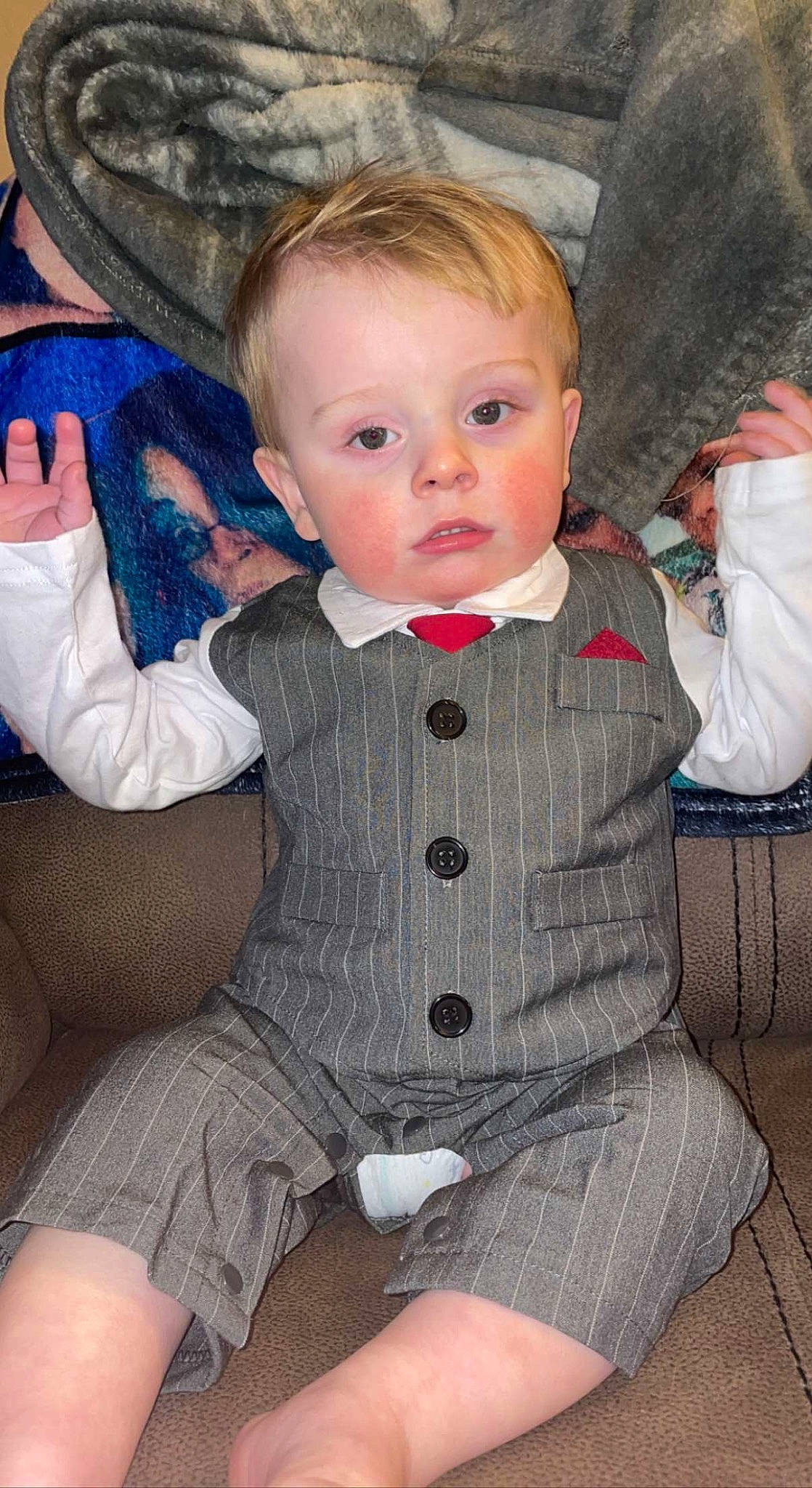 Ryder joined the competition — help win amazing prizes! baby, baby_toddler_clothing, chair, cheek, child, clothing, comfort, dress, human_leg, iris, joint, lap, lip, pattern, person, sitting, skin, sleeve, surprise, textile