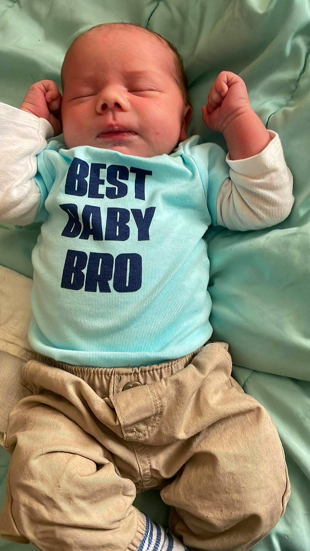 Keegan is registered to the contest to win money with this photo: baby, baby_products, baby_sleeping, baby_toddler_clothing, cheek, chin, comfort, cool, eye, facial_expression, happy, linens, mouth, nose, person, skin, sleeve, smile, t_shirt, textile