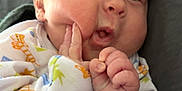 Brynlee is registered to the contest to win money with this photo: baby, bed, blanket, bodypart, couch, crib, face, finger, furniture, hand, head, infantbed, mouth, newborn, person, photography, portrait, quilt, sleeping, wrist