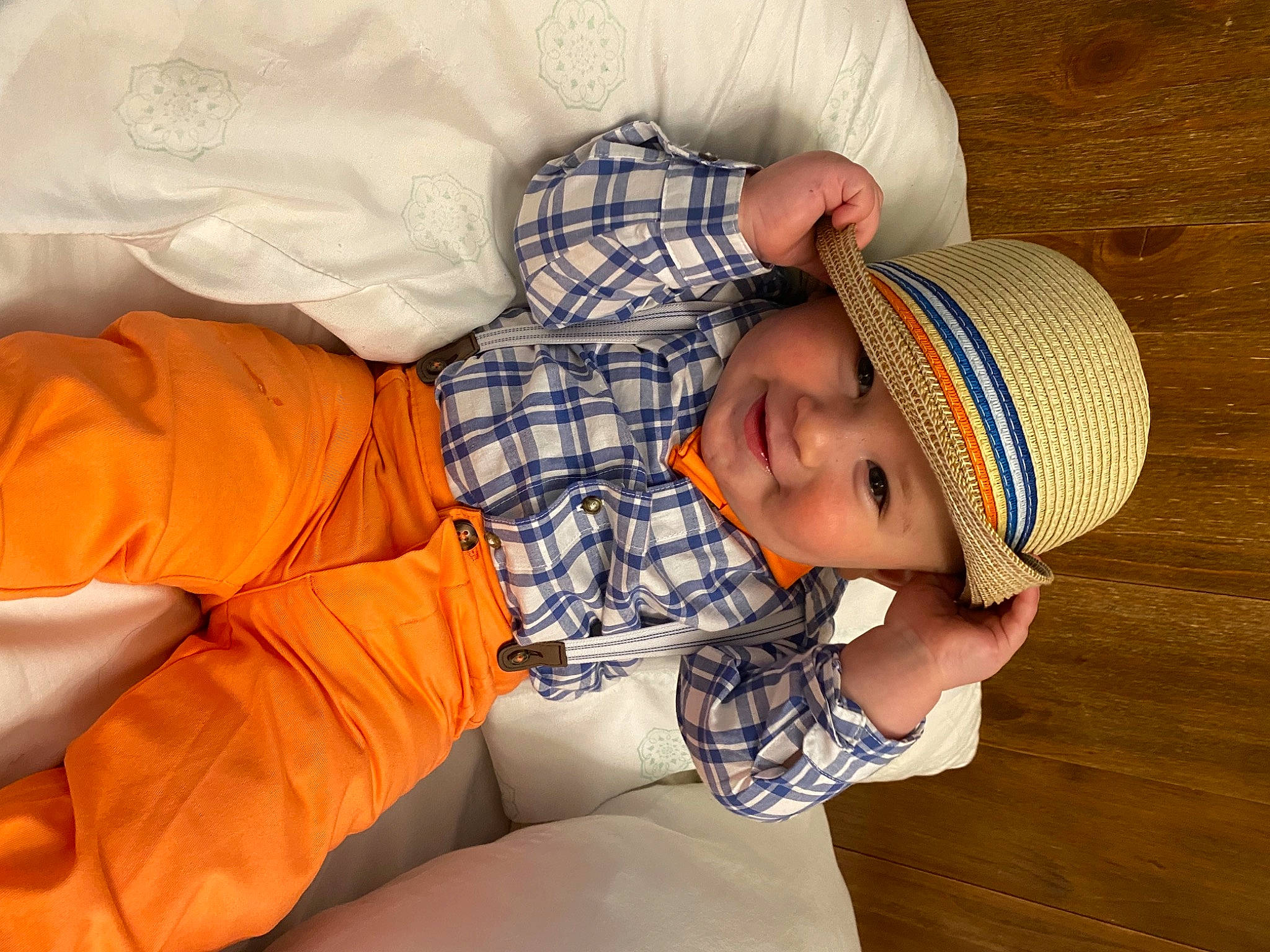 Matteo is registered to the contest to win money with this photo: arm, baby, baby_toddler_clothing, cap, child, comfort, eye, finger, hand, head, headgear, headwear, human_body, knit_cap, pattern, person, skin, sleeve, sun_hat, textile