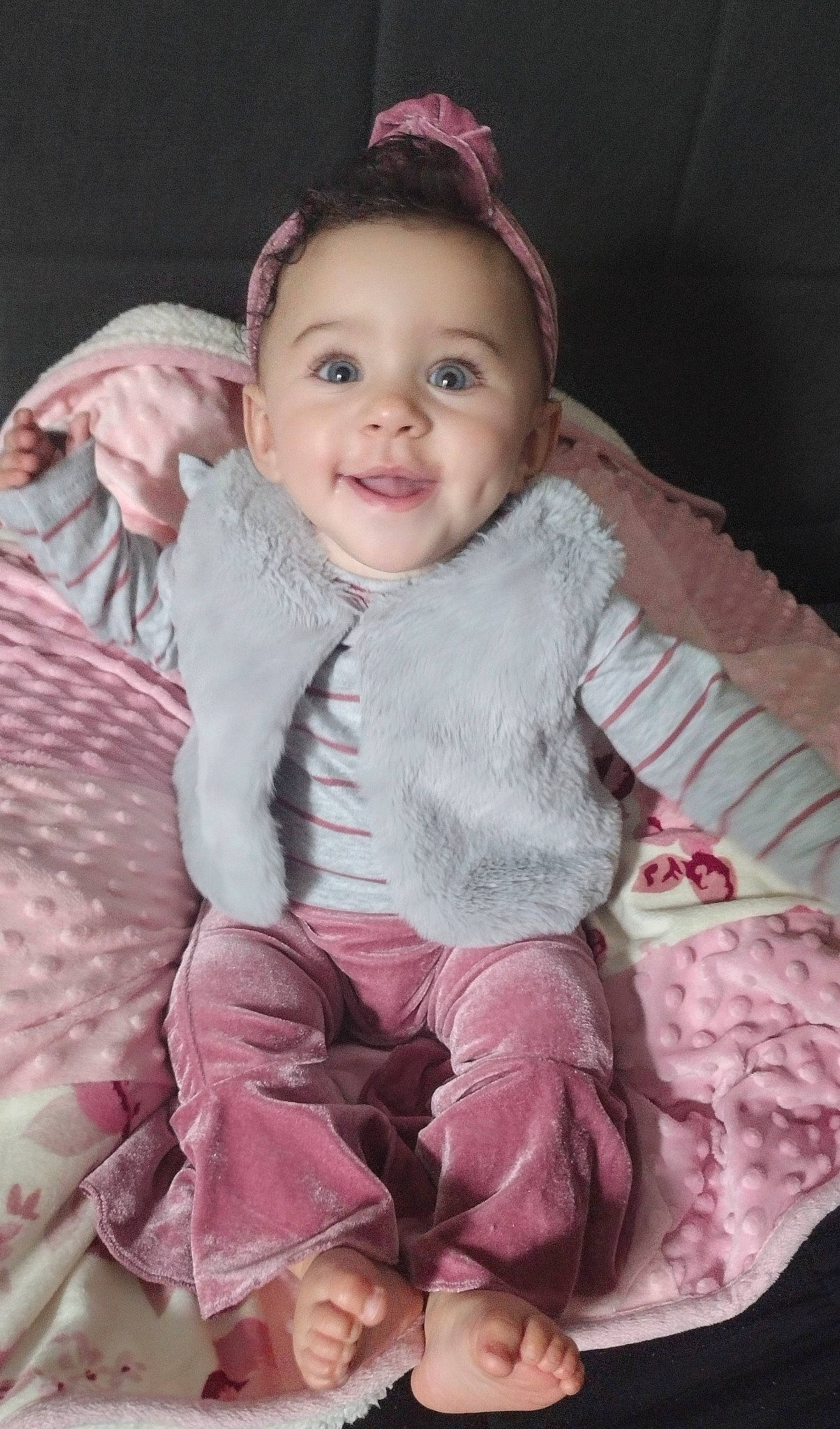 Lilly is registered to the contest to win money with this photo: baby, baby_toddler_clothing, cheek, child, dress, face, flash_photography, happy, headgear, human_body, iris, lip, outerwear, person, pink, purple, skin, sleeve, smile, textile
