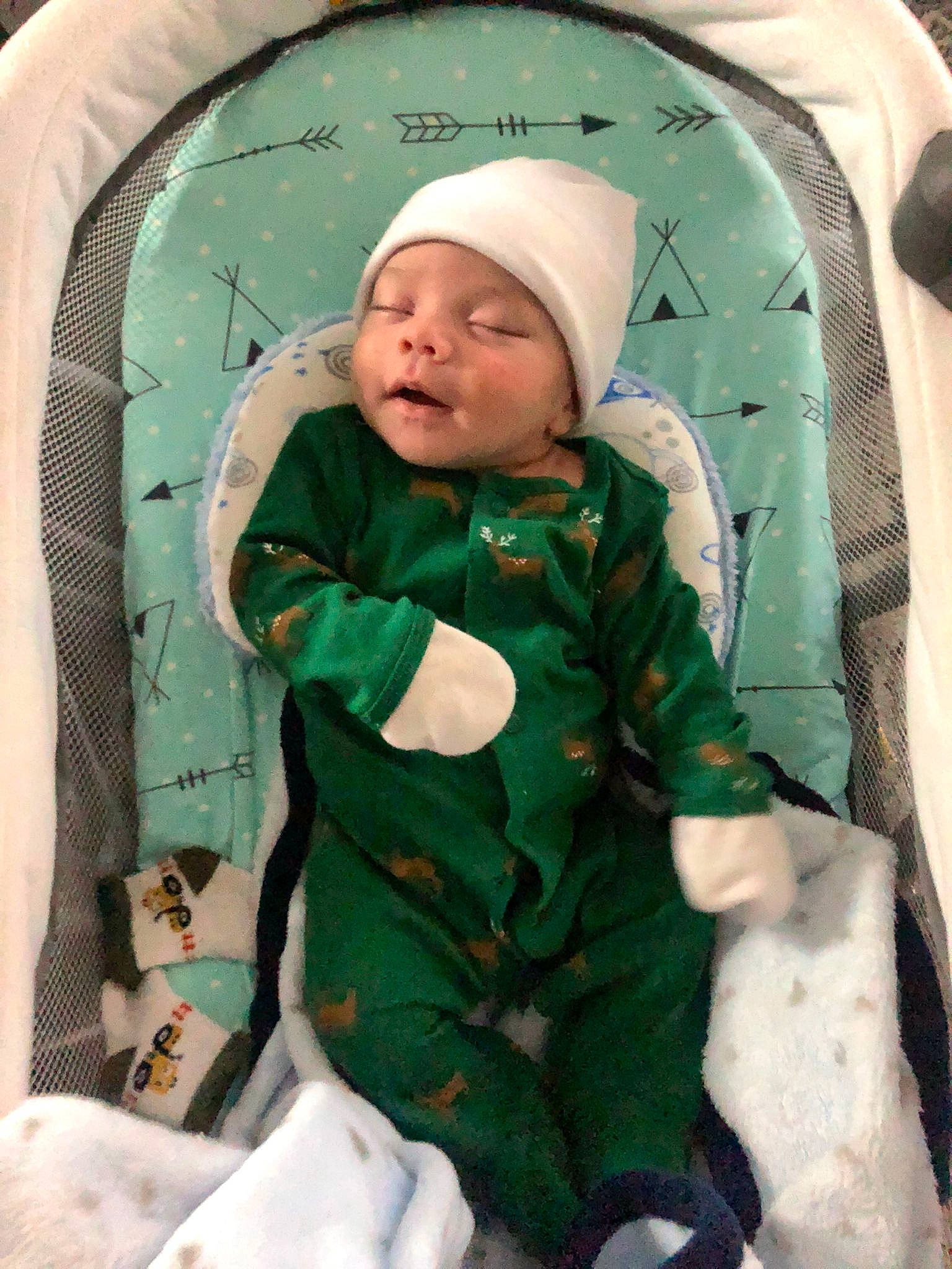 Kaleb is registered to the contest to win money with this photo: baby, baby_products, baby_safety, baby_toddler_clothing, camouflage, cap, child, comfort, face, hat, head, headwear, jacket, linens, military_camouflage, pattern, person, product, room, sleeve