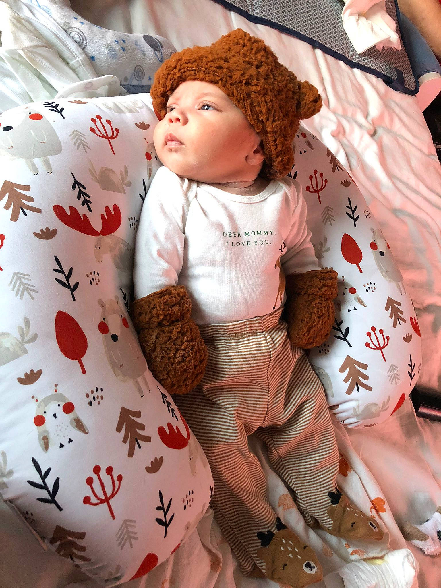 Kaleb joined the competition — help win amazing prizes! baby, baby_toddler_clothing, cap, child, comfort, doll, fashion_accessory, fashion_design, fur, headwear, knit_cap, linens, neck, pattern, peach, person, pink, sitting, skin, sleeve