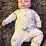 Kole joined the competition — help win amazing prizes! baby, infant, onesie, dinosaur_pattern, sleepwear, fluffy_rug, lying_down, curious_expression, child, soft_texture, indoors, footed_pajamas, small_hands, cute, young_child, cozy, casual, portrait, comfortable, sleepwear_pattern