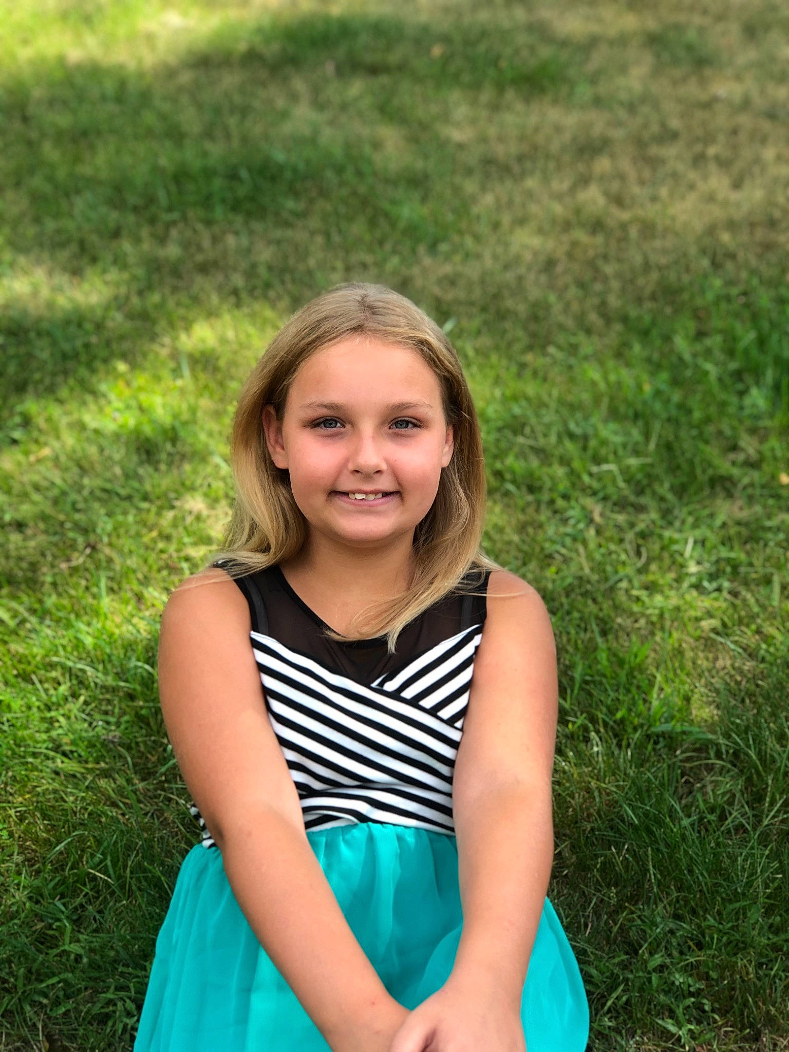 Clara is registered to the contest to win money with this photo: blond, blue, child, child_model, dress, face, fun, grass, grass_family, green, happy, joy, long_hair, meadow, people_in_nature, person, photo_shoot, photography, plant, smile