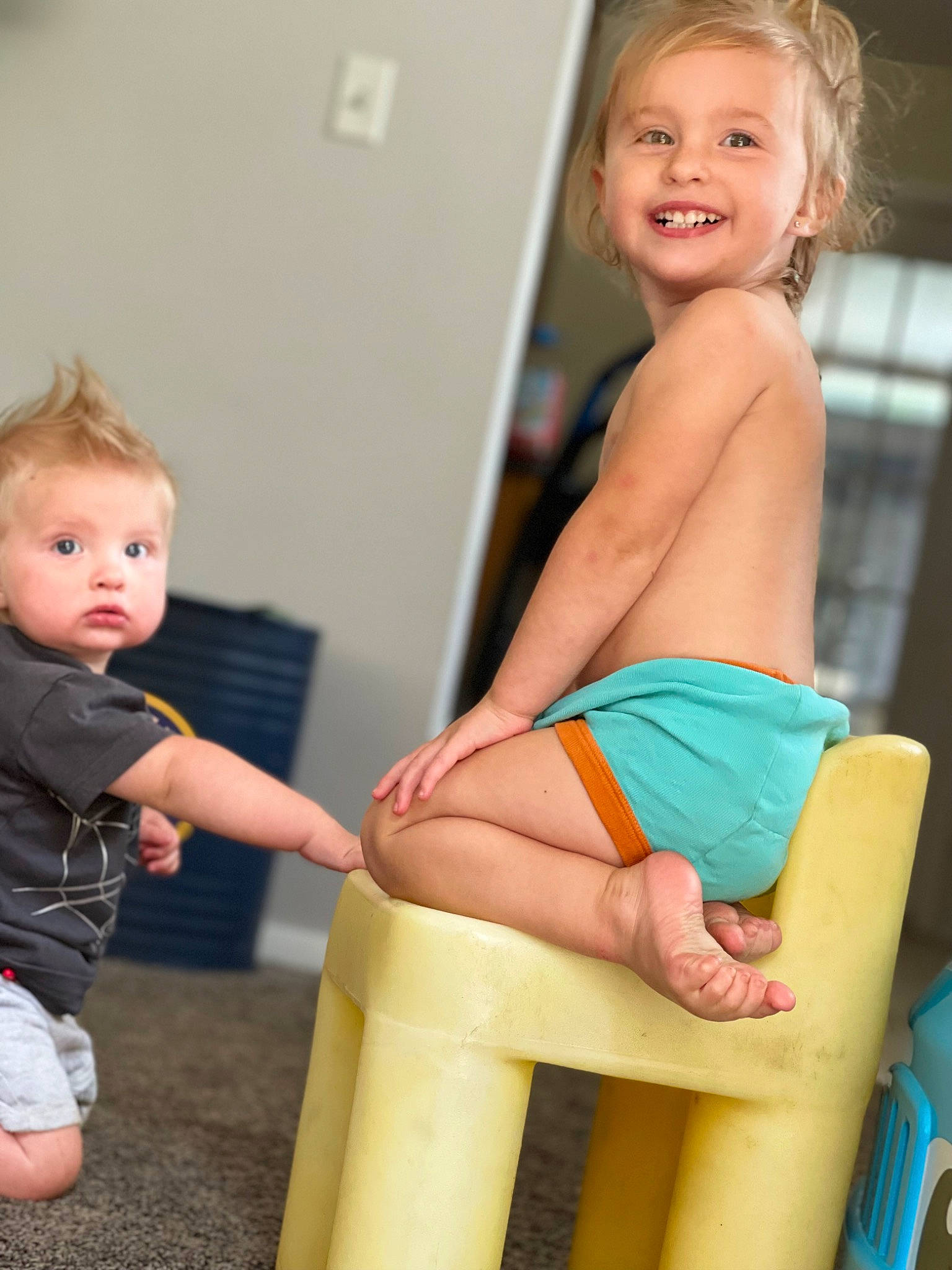 Levi is registered to the contest to win money with this photo: arm, blue, face, facial_expression, finger, hair, hairstyle, happy, head, joint, joy, leg, muscle, person, shorts, shoulder, skin, smile, standing, thigh