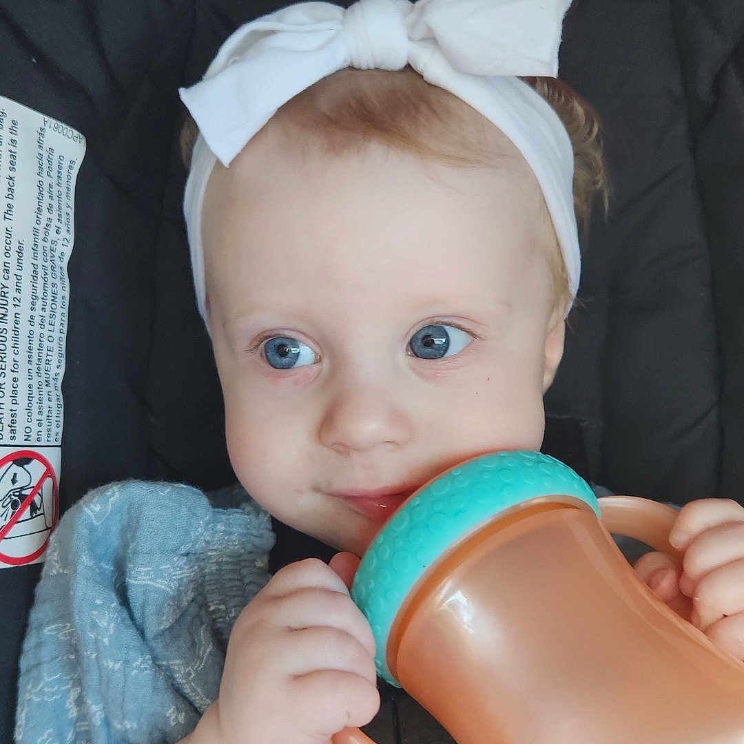 Lacey joined the competition — help win amazing prizes! accessories, baby, beverage, bodypart, clothing, coffee, couch, cup, cushion, face, finger, furniture, hand, head, homedecor, pants, person, photography, portrait, tape