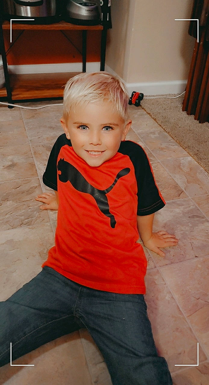 Caden joined the competition — help win amazing prizes! arm, child, child_model, floor, joy, leg, neck, person, shoulder, skin, sleeve, standing, t_shirt, toddler