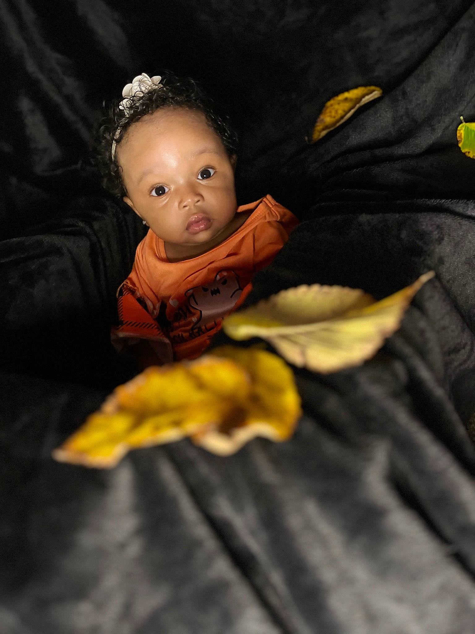 Ocean is registered to the contest to win money with this photo: angel, baby, child, costume_hat, darkness, doll, fashion_accessory, fictional_character, figurine, flash_photography, fun, gesture, headpiece, jewellery, person, room, sitting, sleeve, toddler, toy