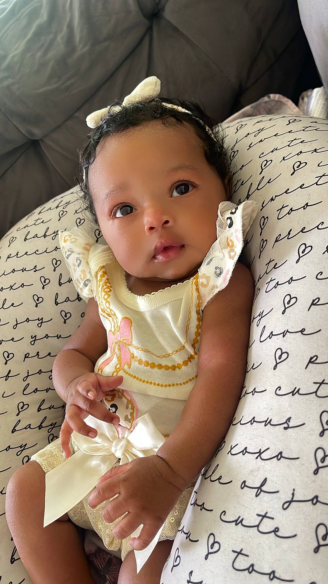 Ocean is registered to the contest to win money with this photo: baby, baby_toddler_clothing, cheek, child, comfort, embellishment, eyelash, fashion_accessory, finger, flash_photography, hand, happy, jewellery, pattern, person, product, sitting, skin, textile, toddler