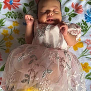 Zhanna is registered to the contest to win money with this photo: adorable, baby, blanket, child, closeup, cute, dress, fabric, face, floral, hand, infant, pattern, peaceful, pink, portrait, resting, sleeping, soft, toddler