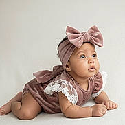 Zhanna joined the competition — help win amazing prizes! baby, infant, tummy_time, headband, bow, velvet, lace, cute, portrait, child, looking_up, soft_lighting, neutral_background, indoors, clothing, adorable, skin, expression, baby_girl, closeup