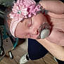 Sina is registered to the contest to win money with this photo: accessory, baby, child, closeup, cute, flower, hand, headband, human, indoors, infant, newborn, pacifier, peaceful, person, resting, skin, sleeping, soft, wearing
