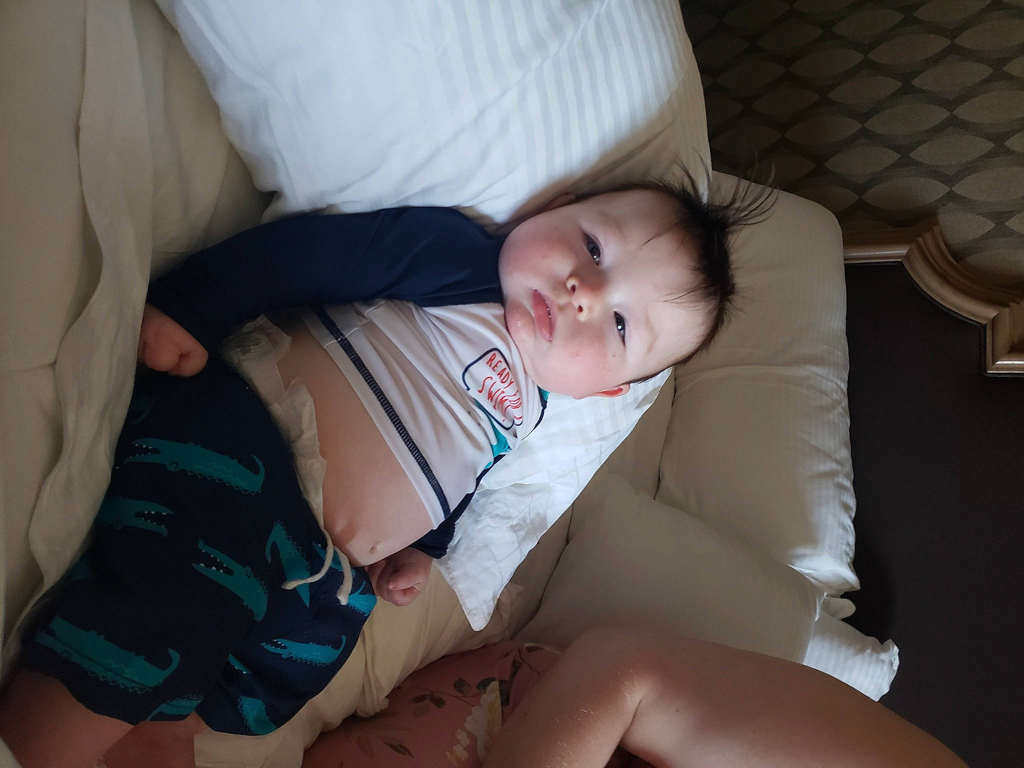 Kaysen is registered to the contest to win money with this photo: abdomen, baby, baby_products, baby_toddler_clothing, child, comfort, elbow, eye, foot, human_leg, knee, lap, person, room, sitting, sleep, thigh, toddler, trunk, wood