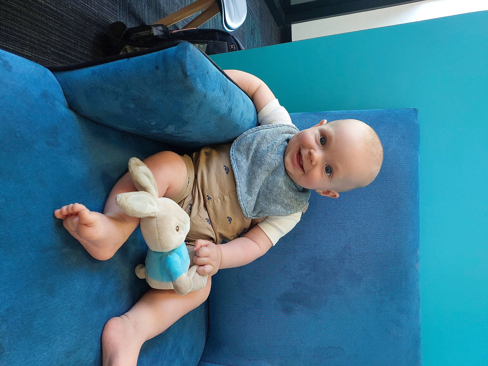 George is registered to the contest to win money with this photo: baby, baby_products, baby_toddler_clothing, blue, child, comfort, elbow, finger, foot, hand, human_body, human_leg, joint, joy, knee, leisure, person, skin, textile, thigh