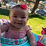 Kathleen joined the competition — help win amazing prizes! baby, child, smiling, flower_headband, pink_clothing, baby_walker, outdoor, grass, tree, car, parked_vehicle, daylight, person, happy, playtime, infant, toy, colorful, cute, portrait