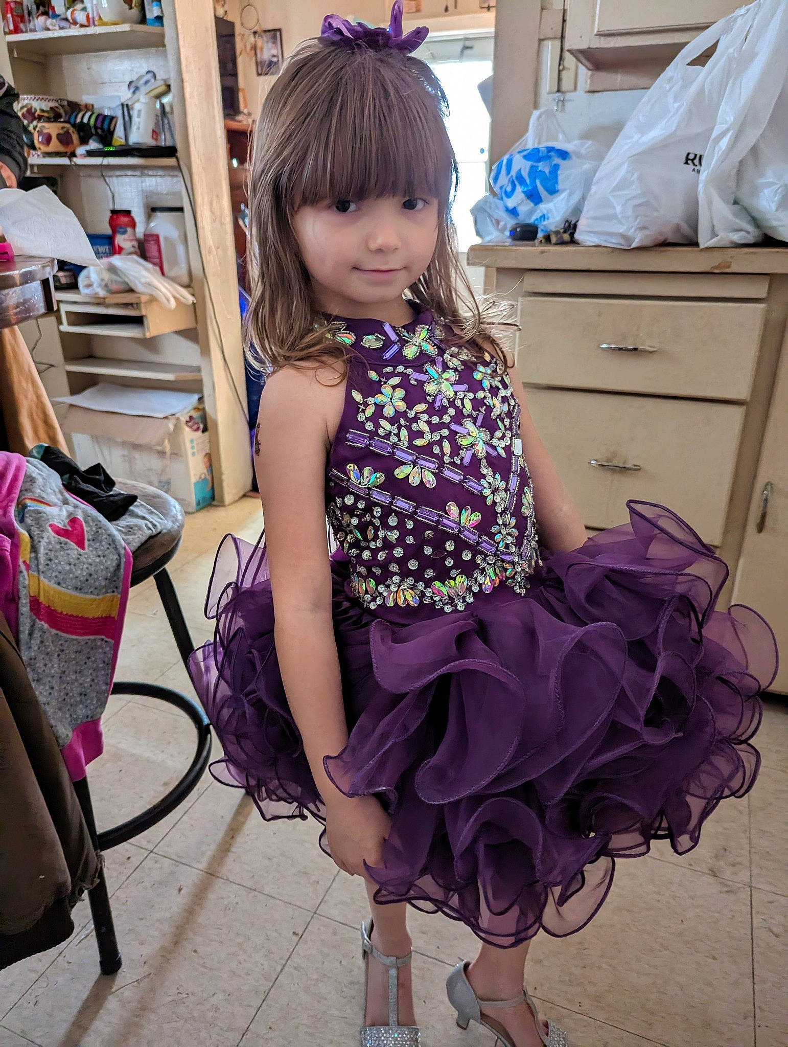 Liberty is registered to the contest to win money with this photo: beauty, black_hair, cabinetry, drawer, dress, eye, eyelash, fashion_design, hairstyle, happy, magenta, person, pink, purple, shoulder, sleeve, textile, thigh, toddler, violet