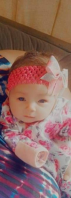 Willow is registered to the contest to win money with this photo: baby, baby_toddler_clothing, cap, cheek, child, chin, eye, eyebrow, face, headgear, headpiece, headwear, iris, knit_cap, lip, magenta, pattern, person, pink, skin