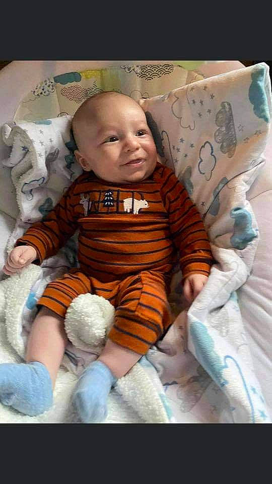 Stormy is registered to the contest to win money with this photo: baby, baby_products, baby_sleeping, baby_toddler_clothing, cheek, child, comfort, face, finger, linens, mammal, orange, person, product, sitting, skin, sleeve, stuffed_toy, t_shirt, textile