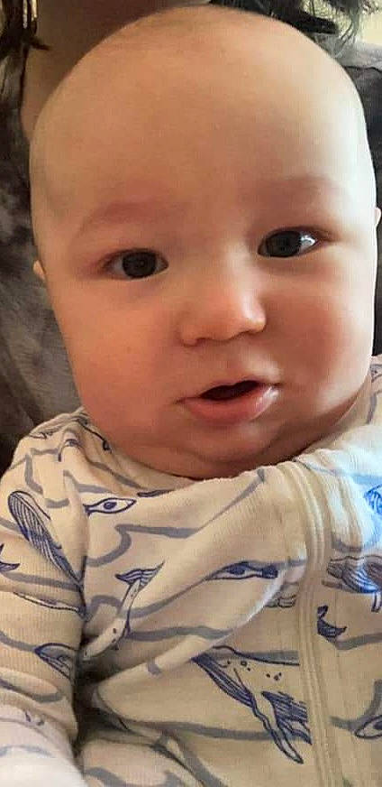 Stormy is registered to the contest to win money with this photo: baby, baby_toddler_clothing, cheek, child, chin, close_up, eye, eyebrow, eyelash, forehead, grass, iris, lip, mouth, nose, pattern, person, photography, skin, sleeve