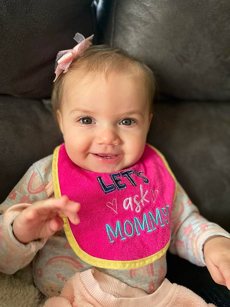 Rosalyn is registered to the contest to win money with this photo: arm, baby, baby_toddler_clothing, cheek, eye, eyebrow, finger, gesture, hair, hand, happy, head, iris, joy, lip, neck, nose, person, pink, skin