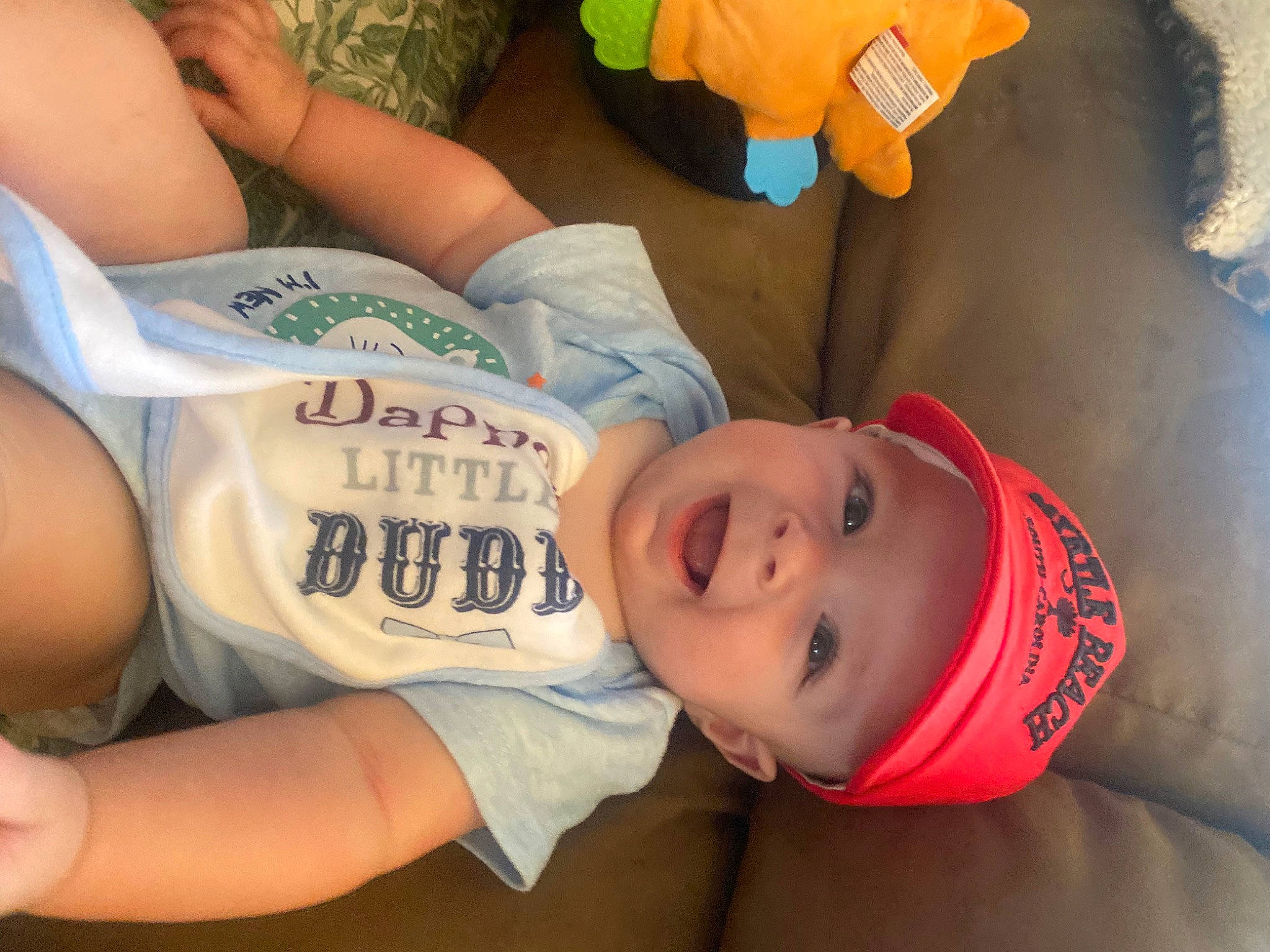 Jaxon joined the competition — help win amazing prizes! baby_toddler_clothing, elbow, eye, facial_expression, finger, fun, happy, hat, headwear, human_body, joint, mouth, muscle, neck, orange, organ, person, skin, smile, t_shirt