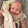 arms, baby, baby_seat, bib, blanket, bunny, clothing, comfort, cushion, cute, face, happy, head, indoors, infant, legs, person, plush_toy, smiling, soft_toy