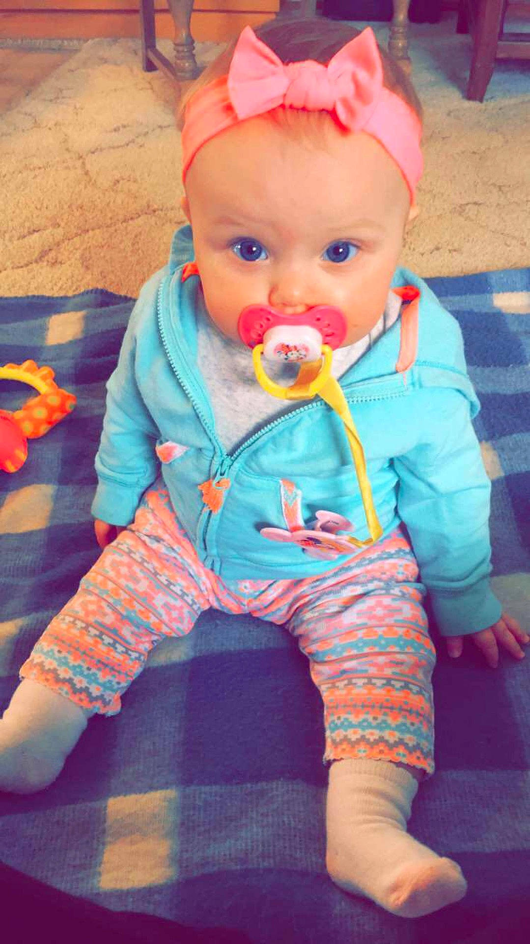 Sunny is registered to the contest to win money with this photo: child, color, doll, eye, human_positions, infant, organ, person, pink, play, sitting, skin, toddler, toy