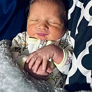 Matthew joined the competition — help win amazing prizes! newborn, baby, sleeping, blanket, pajamas, hand, face, infant, soft, cozy, closeup, child, cute, resting, portrait, indoors, comfort, peaceful, person, warm