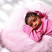 Yaleia is registered to the contest to win money with this photo: baby, newborn, infant, pink, blanket, cushion, soft, cute, clothing, portrait, face, child, sleepwear, resting, cozy, warm, young, skin, head, lying