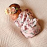 Yasmine joined the competition — help win amazing prizes! newborn, baby, sleeping, flower_headband, pink_outfit, blanket, texture, infant, peaceful, cute, soft_lighting, portrait, child, adorable, resting, cozy, sleep, closeup, baby_clothes, serene