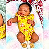 Marlucia joined the competition — help win amazing prizes! baby, infant, newborn, child, portrait, sleeping, lying_down, smiling, yellow_outfit, pink_outfit, floral_clothing, blanket, plush_blanket, bed, indoor, close_up, multiple_photos, triptych, curly_hair, peaceful