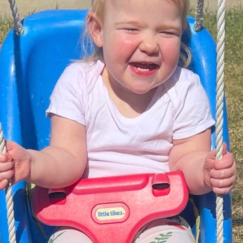 Emmaline Haag is registered to the contest to win money with this photo: baby, ball, clothing, face, football, grass, happy, head, outdoorplayarea, outdoors, person, photography, plant, playarea, portrait, shorts, soccer, summer, t_shirt, toy