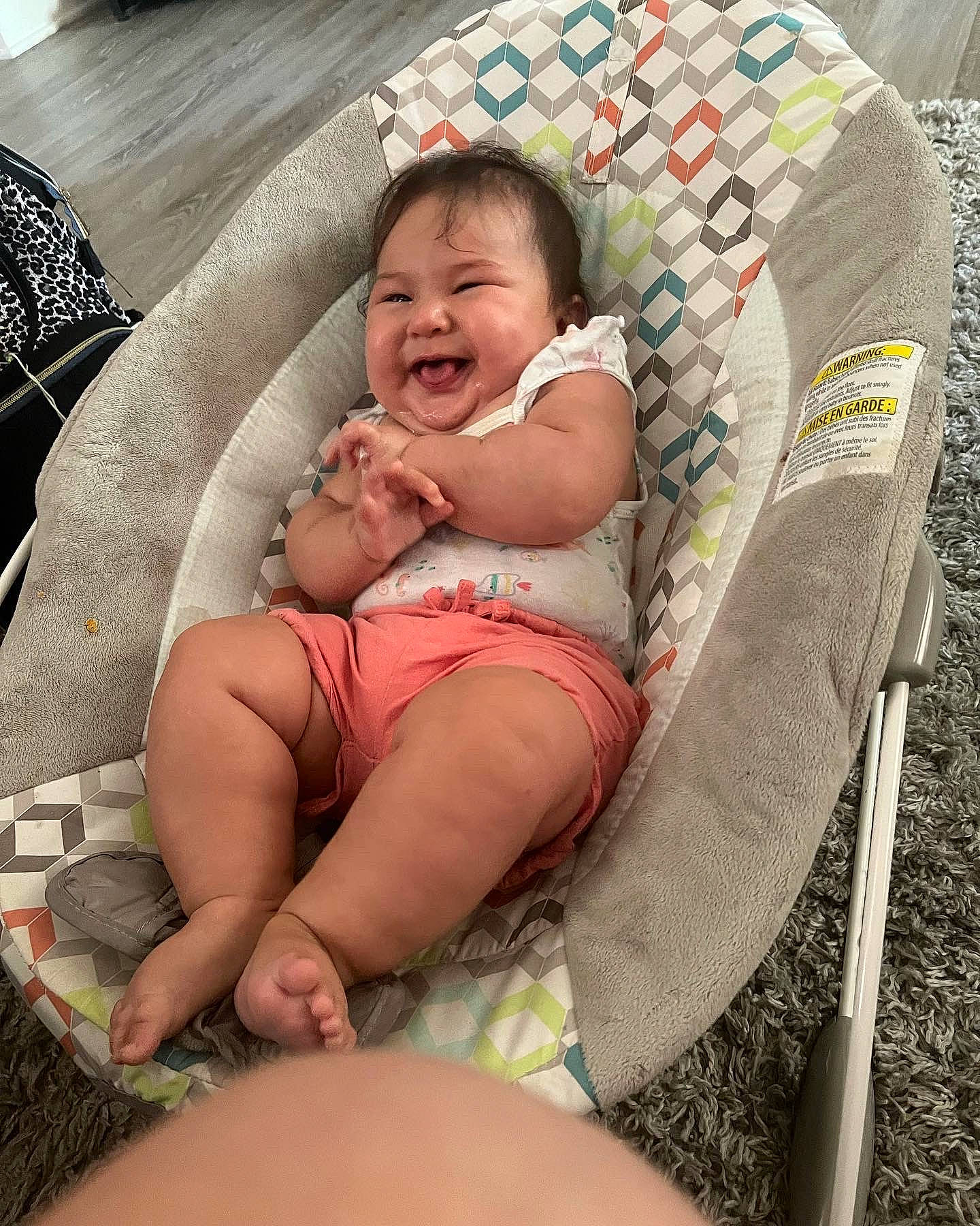 Amelia joined the competition — help win amazing prizes! baby, baby_products, baby_toddler_clothing, child, comfort, eye, facial_expression, fun, grass, hairstyle, happy, human_leg, knee, lap, leg, leisure, person, skin, smile, thigh