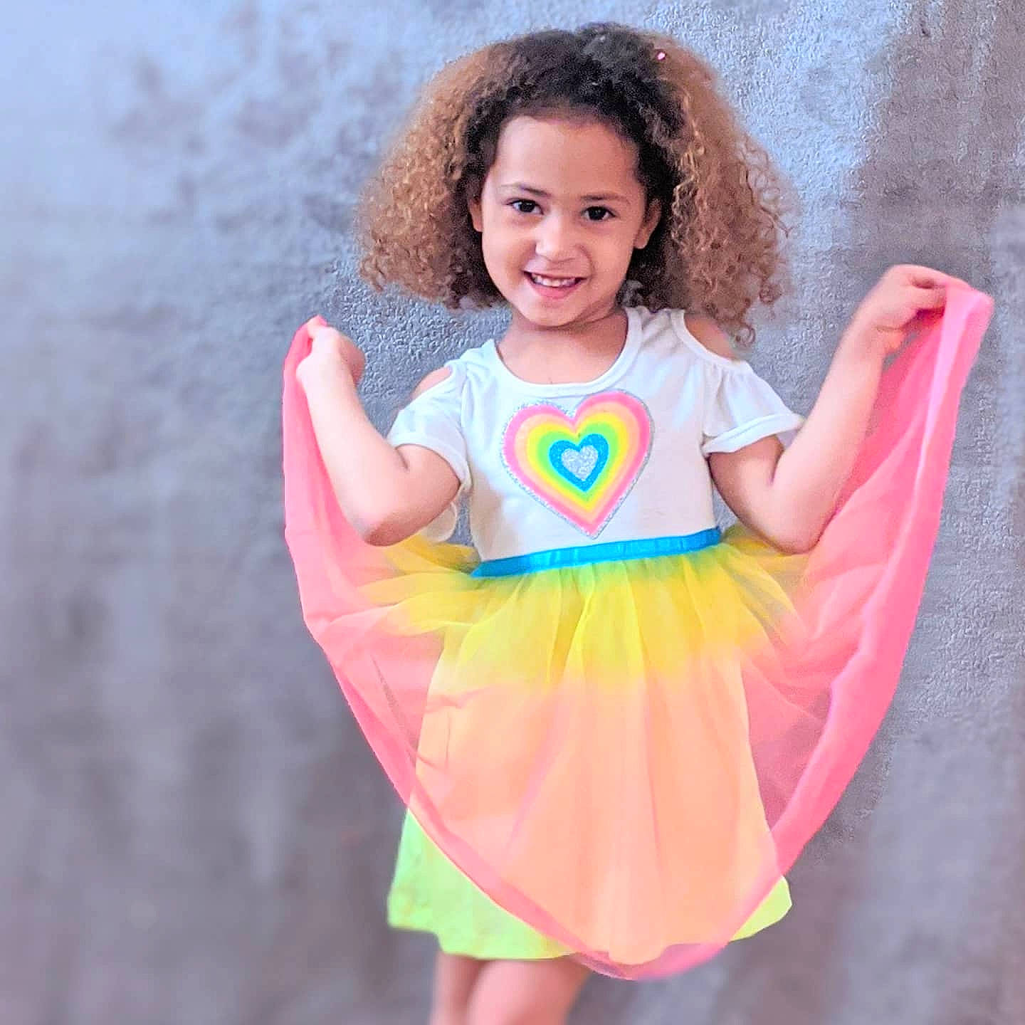 Thalia joined the competition — help win amazing prizes! child, child_model, clothing, costume, fictional_character, finger, joy, orange, pattern, person, pink, sleeve, smile, thumb, toddler, yellow