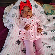 A'Leysa Tayonna joined the competition — help win amazing prizes! baby, child, infant, blanket, elephant_print, pink_clothing, headband, red_bow, lying_down, cozy, soft_toys, cute, tongue_out, indoor, carpet, floor, furniture, room, legs, feet