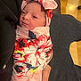 Ellieana joined the competition — help win amazing prizes! newborn, baby, infant, swaddle, headband, floral_pattern, wrapped, sleepy, cute, person, hand, cradling, indoors, fabric, soft, closeup, portrait, skin, resting, tender