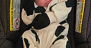 Braylee joined the competition — help win amazing prizes! baby, black_and_white, car_seat, child, clothing, comfortable, cozy, cute, footwear, head_support, indoor, infant, mittens, onesie, patterned, peaceful, resting, sleeping, soft, young