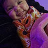 baby, bed, blanket, child, clothing, comfort, cozy, cute, face, happy, indoor, portrait, purple_light, resting, sleepy, smiling, soft, sunflower_pattern, toddler, warm