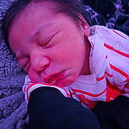 Braylee joined the competition — help win amazing prizes! baby, newborn, sleeping, face, closed_eyes, blanket, onesie, stripes, cozy, infant, skin, hair, cheek, mouth, portrait, closeup, fabric, arm, sleeve, resting