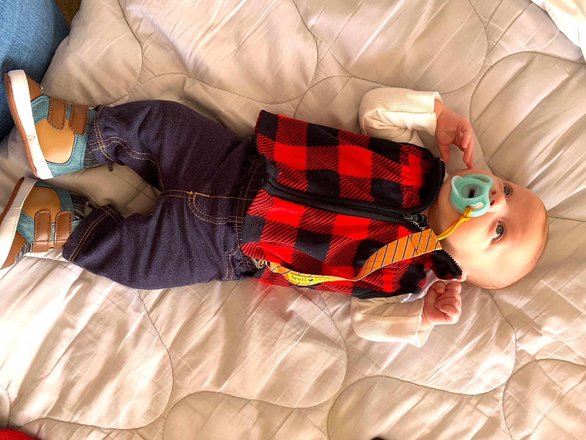 Keanu joined the competition — help win amazing prizes! abdomen, baby, child, comfort, couch, glasses, human_body, human_leg, knee, lap, leg, linens, nail, orange, pattern, person, plaid, sunglasses, tartan, thigh