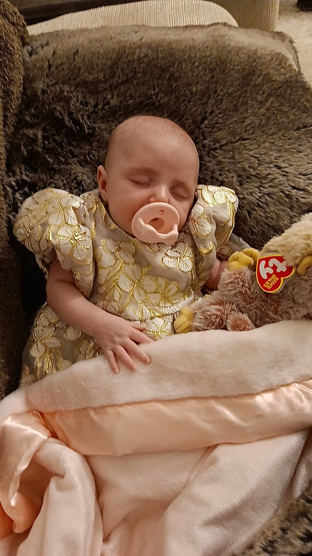 Everlie is registered to the contest to win money with this photo: baby, baby_products, baby_sleeping, baby_toddler_clothing, cheek, child, comfort, event, fur, grass, happy, head, linens, peach, person, portrait_photography, sitting, skin, sleeve, textile