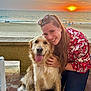 woman, dog, golden_retriever, sunset, beach, ocean, smiling, hugging, outdoor, casual_clothing, long_hair, sunglasses, happy, pet, sand, water, sky, waves, nature, evening
