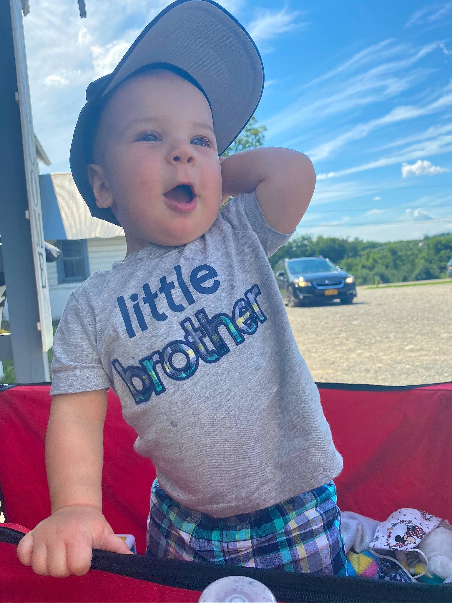 Maverick is registered to the contest to win money with this photo: arm, azure, blue, cap, cloud, cool, electric_blue, finger, fun, happy, hat, leisure, morning, person, plaid, sky, sleeve, t_shirt, tableware, tartan