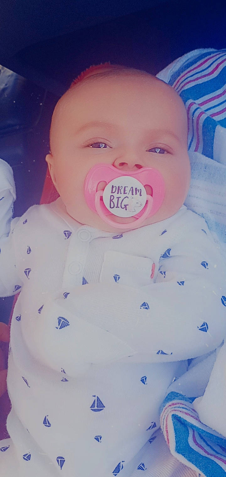 Holly is registered to the contest to win money with this photo: art, baby, baby_products, baby_toddler_clothing, cheek, child, chin, electric_blue, fun, happy, lip, magenta, mouth, nose, pink, product, skin, sleeve, toddler