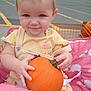 Freya joined the competition — help win amazing prizes! baby, child, pumpkin, stroller, pink, elephant_pattern, yellow_clothing, parking_lot, outdoor, smile, face, hands, cute, holding, autumn, fall, baby_clothes, seat_belt, person, small_child